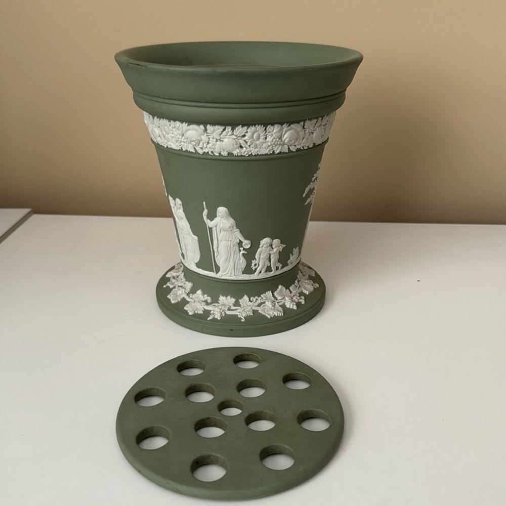 Wedgwood green vase. Classic design 6.5 high. Has flower arrangement insert.